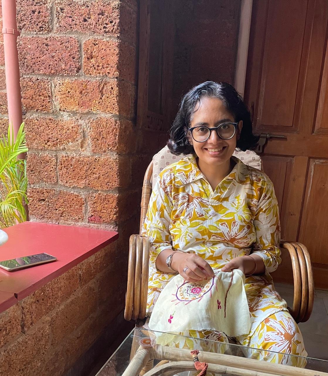 Contributor embroidering at Peace Cottage, Goa